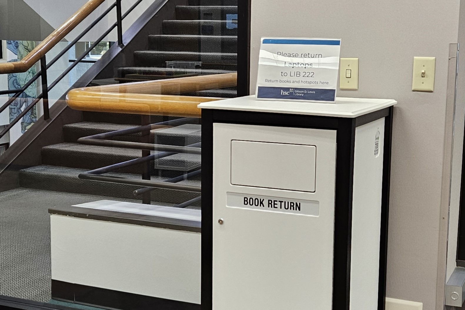 Book Return temporarily located on level 3, near central stairwell for level 2 renovation phase