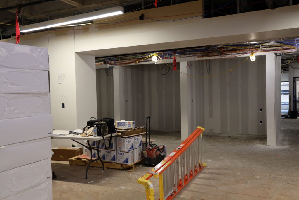 Quiet study area of fourth floor, Gibson D. Lewis Library construction photo showing new walls built for individual study rooms
